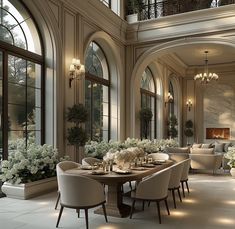 an elegant dining room with high ceilings and large windows