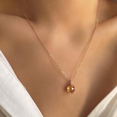 This exquisite necklace features a dainty citrine gemstone set in a unique design inspired by nature, with delicate branches and leaves embracing the stone. The golden hue of the citrine beautifully complements the intricate details of the setting, creating a piece that is both elegant and timeless. Crafted in high-quality sterling silver, this necklace is perfect for adding a touch of sophistication to any outfit. It makes a thoughtful gift for her, whether it's a special occasion like Mother's Thoughtful Gifts For Her, Citrine Jewelry, Citrine Pendant, Citrine Necklace, Citrine Ring, Citrine Gemstone, Layered Necklaces, Sterling Silver Necklaces, Citrine