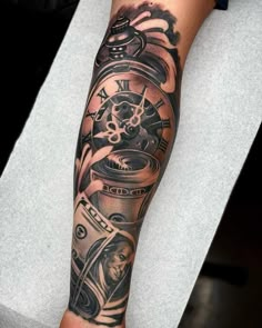 a man's arm with a clock and money tattoo on the forearm, in black and grey