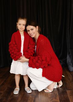 "Keep your little one warm and comfortable with our wonderful knitted sweater. A warm and soft coat is perfect for both stylish minimalist dresses and your child's everyday wear. The sweater has a loose fit, which makes it very comfortable for your child. The shoulder line is displaced. Delicate knitted cardigan made of quality yarn with the addition of 50 % wool, 50% acrylic. The cardigan is very practical. In the photo color - red . Adult Sweater measurements (measurements taken in a horizonta Red Sweater Outfit, Girl Cardigan, Woolen Clothes, Pullover Outfit, Mohair Cardigan, Girls Cardigan, Minimalist Dresses, Mommy And Me Outfits