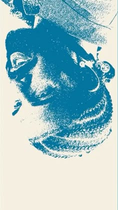 a blue and white poster with an image of a man's head in the middle