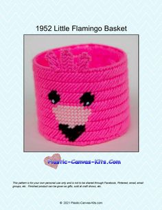 a pink knitted basket with a smiling face on the front and bottom, is shown