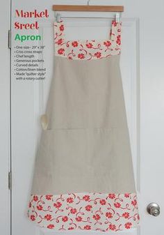 an apron hanging on a door with the words market street apron written in red and white