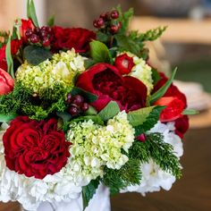 Thoughtfully arranged in a ceramic cachepot, this holiday arrangement features a festive and rich palette of blooms. Our curated arrangements are the perfect centerpiece for holiday celebrations, and make a wonderful gift for loved ones.The choice of flowers and vase may vary depending on seasonal availability. Rest assured, we will make substitutions with the finest available options if necessary.Delivery is available for arrangements over $150 (plus delivery fee).FLORAL ARRANGEMENTS ARE FINAL Christmas Arrangements Floral, Floral Design Business, Magnolia Leaf Wreath, Fall Floral Arrangements, Holiday Arrangement, Magnolia Leaves, Holiday Floral, Leaf Wreath