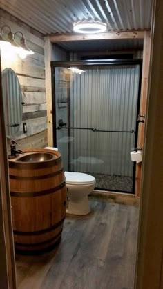 a bathroom with a wooden barrel in it