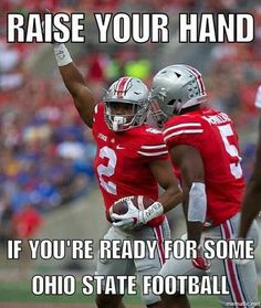 two football players giving each other high fives on the field with words that read raise your hand if you're ready for some ohio state football