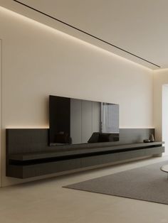 a modern living room with white walls and grey carpeted flooring on the side