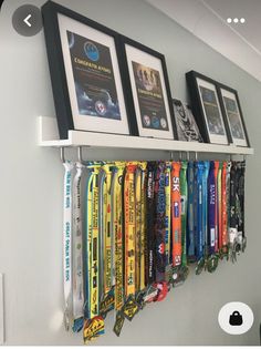 a row of medals hanging on a wall