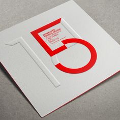 the letter e is made up of red and white paper