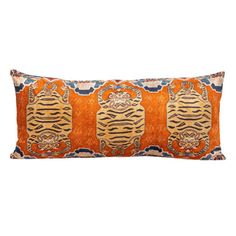 an orange and blue decorative pillow with tigers on it