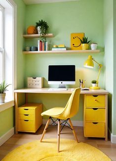 a yellow chair sits in front of a computer desk