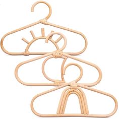 three wooden clothes hangers are shown on a white background, one is made out of bamboo