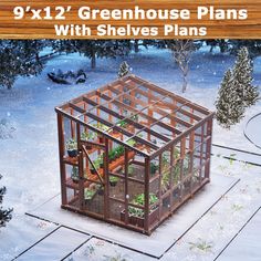 a small greenhouse with plants inside in the snow