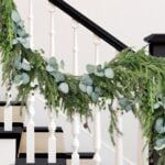 the garland on the banisters is decorated with greenery