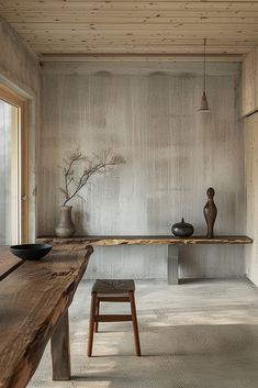 a wooden table and bench in a room