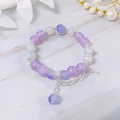 [Size] In picture (string) : 16 cm Bead : 10 mm [String Material]      Wire : keeps its shape, but is harder to put on by yourself.      String : doesn't keep its shape, but is very easy to put on by yourself. (Please note that the string version may look different due to size differences) Picture String, Crafting Table, Pictures On String, Girly Bracelets, Aesthetic Jewellery, Glass Bead Bracelet, Beads Bracelet Design, Crystal Beads Bracelet, Bracelet Design