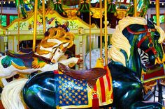 a merry go round with two horses on it