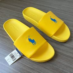 Polo Ralph Lauren Cayson Big Pony Slide Us Sizes Color: Yellow Fin/Blue This Classic Pool Slide Gets A Signature Polo Finish With Ralph Lauren's Iconic Big Pony Embroidered At The Top. A Padded Eva Construction Provides Extra Support And Comfort. Open Toe. Slip-On Styling. Padded Footbed. Eva Midsole. Signature Pony Embroidered At The Top. Knit Lining At The Vamp. Treaded Rubber Outsole. Upper: 100% Polyurethane. Lining: 80% Nylon, 20% Elastane. Imported. Thanks For Looking And Good Luck! Medical Shoes, Pool Slide, Adidas Shoes Women, Walker Shoes, Hand Watch, Men's Sandals, Sneakers Men Fashion