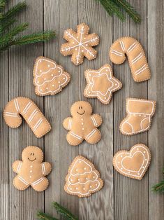 gingerbread cookies are arranged on a wooden table