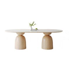 a white table with two wooden pedestals and a flower vase on top that says aora