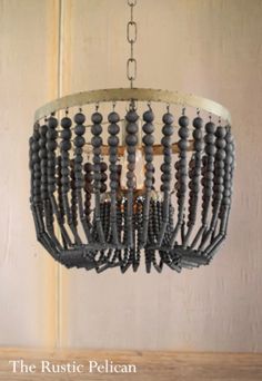 the rustic pelican chandelier is made from wood beads