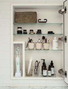 a bathroom shelf filled with personal care items