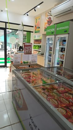 the inside of a restaurant with food on display