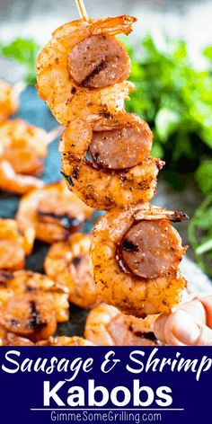 sausage and shrimp kabobs on skewers with lettuce in the background