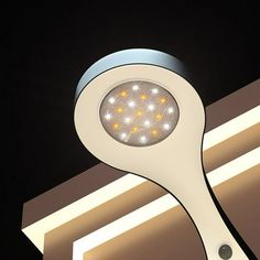 a close up of a light fixture on a ceiling in a dark room with lights