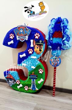 the number five is decorated with paw patrol decorations