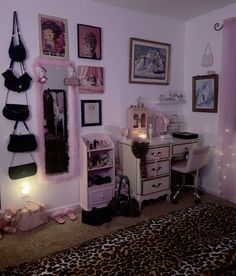 a bedroom decorated in pink and leopard print