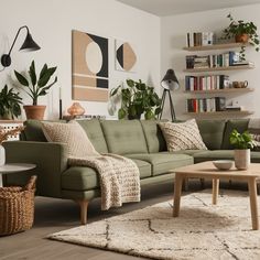 a living room filled with furniture and lots of plants