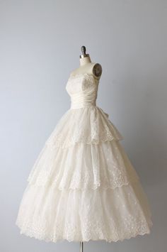 a white wedding dress on a mannequin