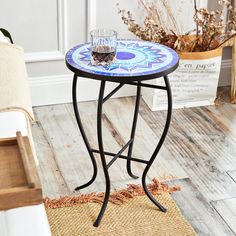 a small table with a glass on it