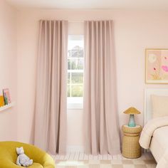 a bedroom with pink walls and curtains in the window, a yellow chair sits next to it