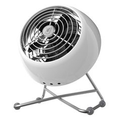 a white fan sitting on top of a metal stand