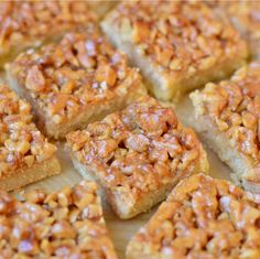 several pieces of cake sitting on top of a white plate with brown sugar toppings