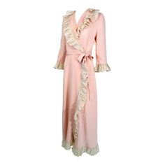 1930s-40s pink rayon with cream lace wrap & tie robe. A beautiful robe reminiscent of robes worn in Hollywood movies from the late 1930s thru the early 1940s. Silky pink rayon is trimmed with a deep ruffle of ivory cream lace. The robe has a deep collar with a wrap front and attached self tie belt. 3/4 length sleeves with lace cuffs. The robe closes at the side front outside with a snap and on the inside with a self tab with hook & eye. The bias skirt skims the hips and flares at the hem. Unline 1930s Nightgown, 1920s Robe, Vintage Fashion 1930s, 1900 Fashion, Bias Skirt, Hollywood Movies, Color Crema, Lace Cuffs, Lace Wrap