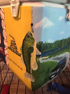 a fish painted on the side of a cooler