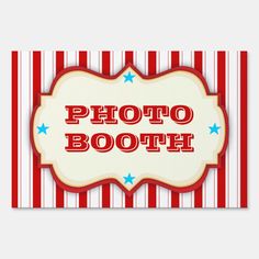 a sign that says photo booth on the side of a wall with red, white and blue stripes