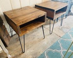 two wooden tables with hairpin legs are sitting on the floor next to each other