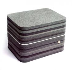 a stack of four mattresses sitting on top of each other in front of a white background