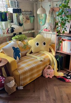 a living room filled with furniture and stuffed animals