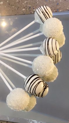 cake pops with white and black stripes on them