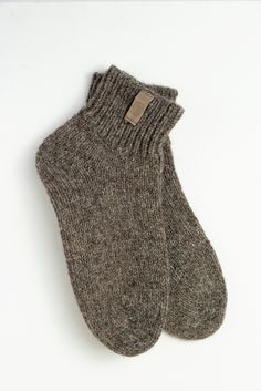 These natural wool socks are handmade following Scandinavian design. They will warm you or your beloved ones during the coldest winter months. Warm woolen socks are also a great gift idea. The socks are made from cruelty-free sheep and dog wool. Dogs are combed, and their hair is mixed with sheep wool to get the perfect combination. Researchers have found that man benefits from dog wool, which has healing properties. It relieves a wide range of pain, especially radiculitis. Knits made of dog woo Cozy Brown Socks For Stocking Stuffers, Cozy Warm Brown Socks, Woolen Socks, Hygge Gifts, Style Socks, Woolen Sweaters, Christmas Gift Idea, Wool Socks, Style Expert