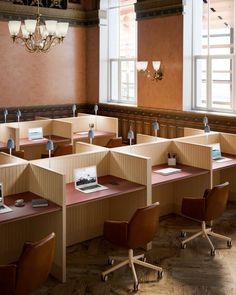 an empty room with desks and chairs in it