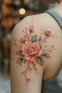 a woman's shoulder with flowers on it