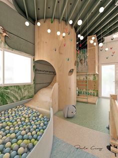 an indoor play area with balls and slides