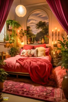 a bedroom decorated in red and gold with candles on the wall, potted plants