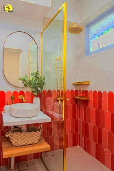 a bathroom with red and yellow tiles on the walls